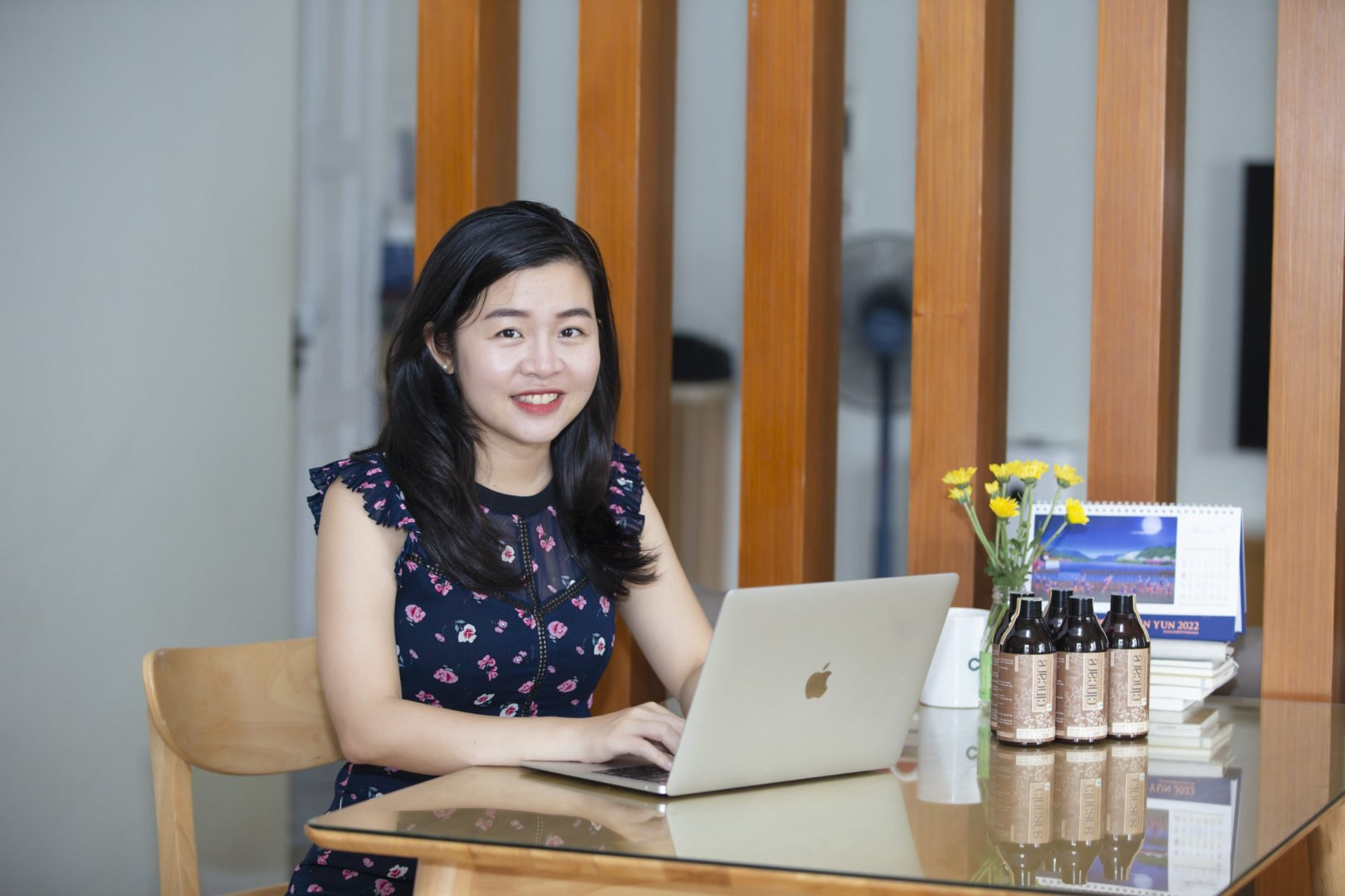 Quynh Nguyen, founder of AZCare, does desk work