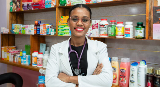 Dr. Hollina Alfred poses for a photograph behind the counter in Holli Care, in Albouystown, Georgetown, Guyana. 24 June 2024.