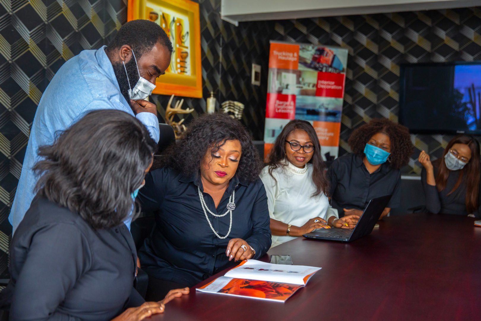 Ngozie Oyewole, the CEO of Noxie Limited, goes through a new brochure for her company at the Noxie Limited conference room in Lagos, Nigeria on 27th January 2021. The Cherie Blair Foundation for Women continues to support women entrepreneurs across many African countries, including Nigeria, through their blended learning programmes, like Road to Growth and HerVenture.