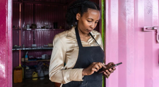 Wangari Mwaura is using the HeVenture app outside her workshop where she is producing organic soaps, in Kenol town, Kenya, on Wednesday, Sep. 30, 2020. Wangari Mwaura is using HerVenture, a busines skills training mobile app created by the Cherie Blair Foundation for Women. The app features seven learning ‘tracks’ on a range of needs, including launching a business, product innovation and expanding market access, and a new track focusing on e-commerce