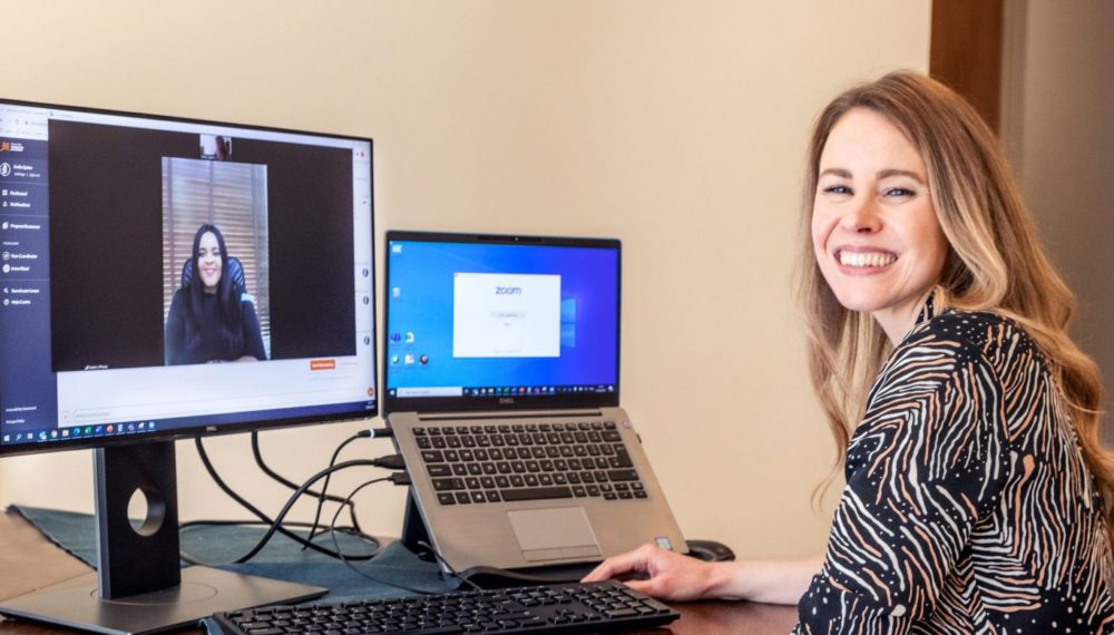 Emily Quinn works with her mentee in a video call.
