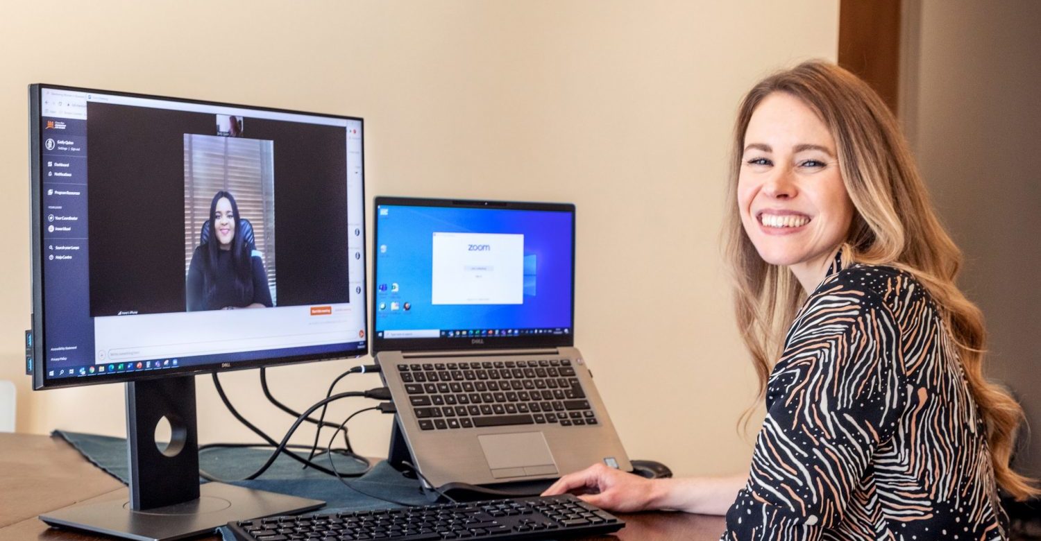 Emily Quinn works with her mentee in a video call.