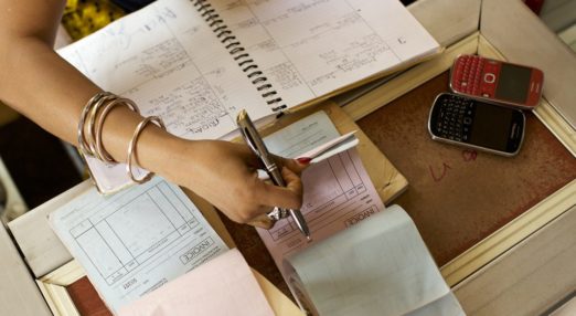 Woman entrepreneur manages finances