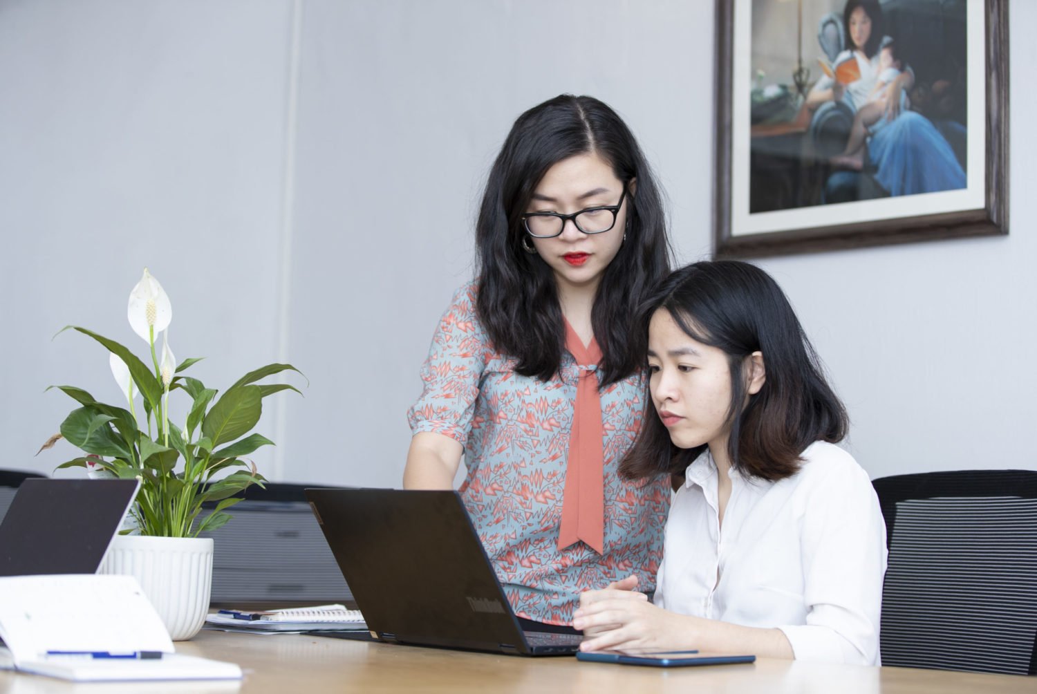 Quynh Nguyen, founder of AZCare, works with a colleague