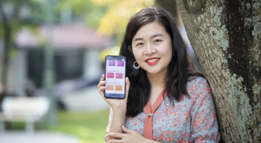 Quynh Nguyen, founder of AZCare, and WEAVE alumna poses with the HerVenture app