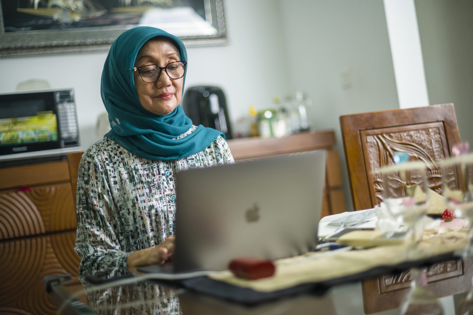 Jullie Hakim works on her computer