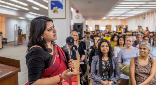 Woman speaks to a room of women