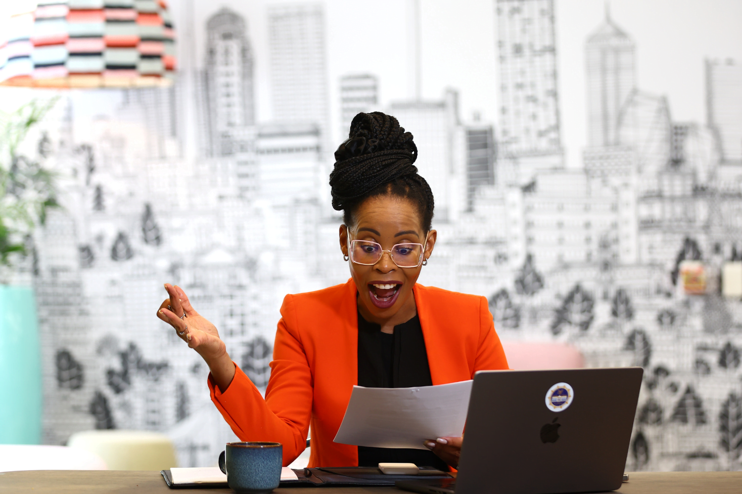 Queen Mokulubete, Founder of Somila Engineering, does deskwork at her office.