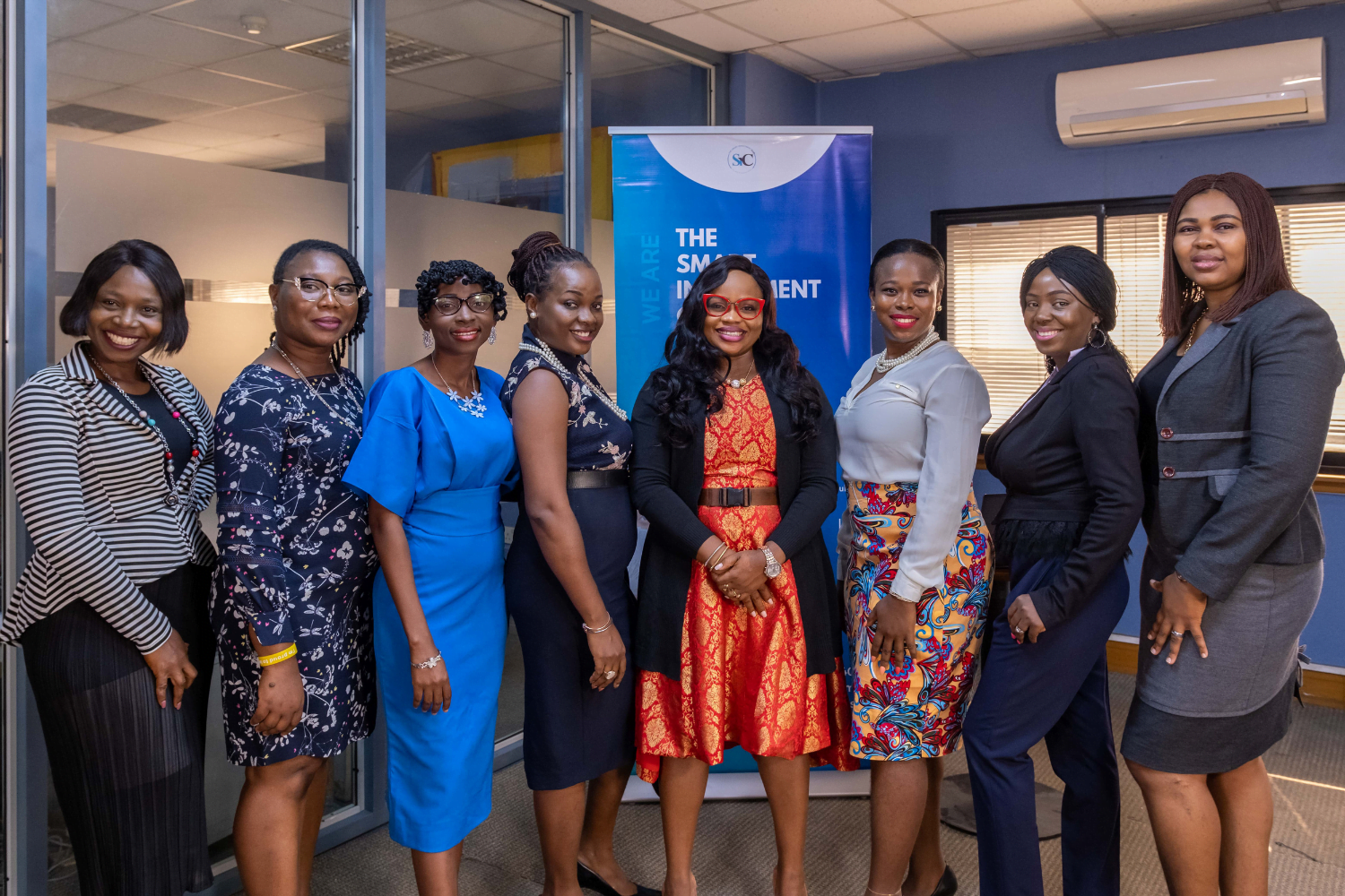 Sola Adesakin poses with colleagues at her business, Smart Stewards, in Nigeria.