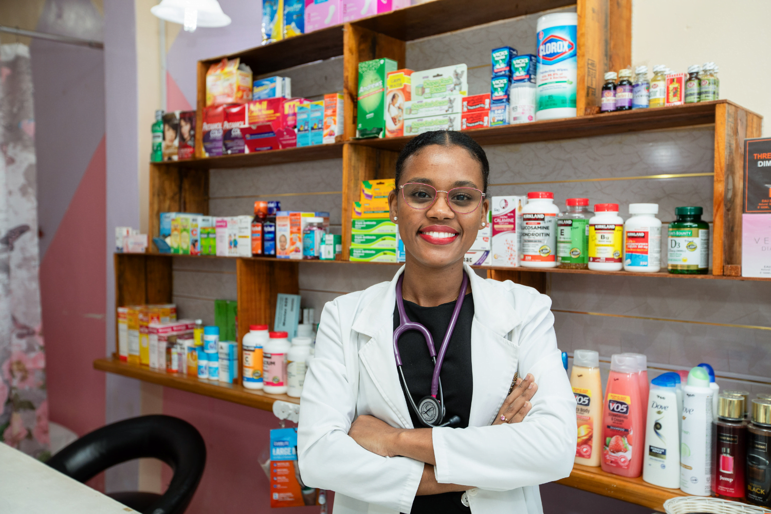 Dr. Hollina Alfred poses for a photograph behind the counter in Holli Care, in Albouystown, Georgetown, Guyana. 24 June 2024.