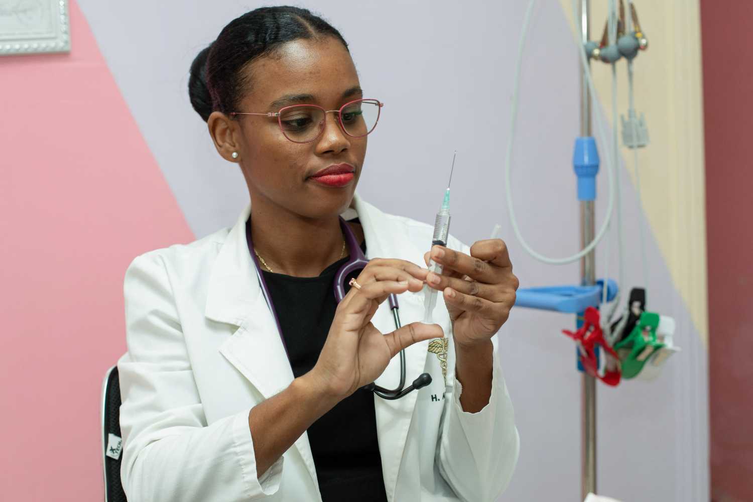 Dr. Hollina Alfred works with medical equipment at Holli Care, in Albouystown, Georgetown, Guyana. 24 June 2024.