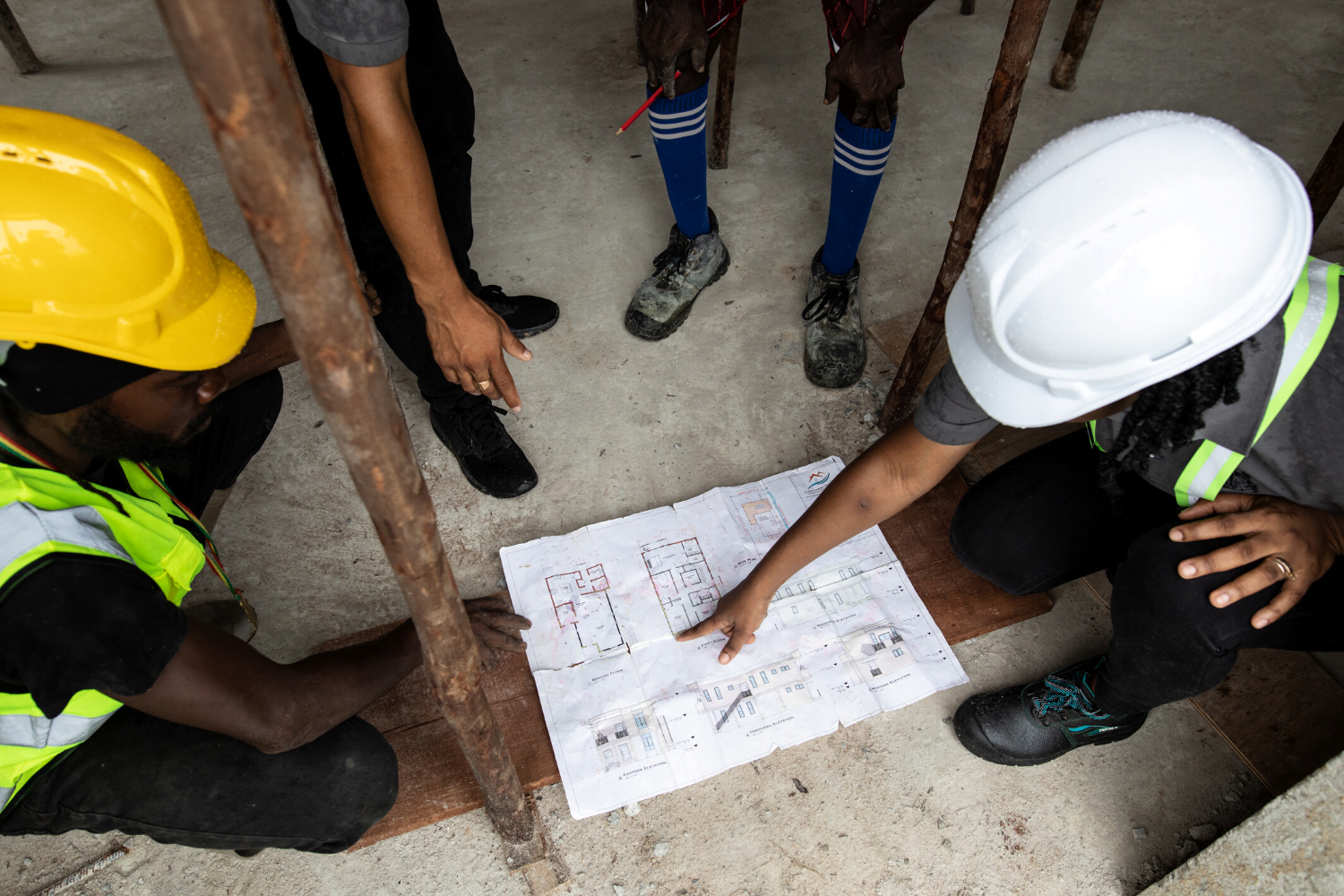 Nakaida Belle- Lindie shows blueprints for a construction site to her staff
