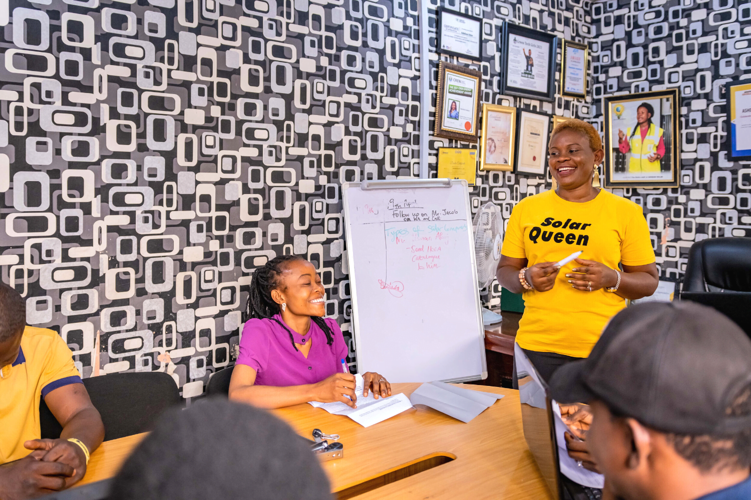 Damilola Asaleye leads a meeting at Ashdam Solar Company office