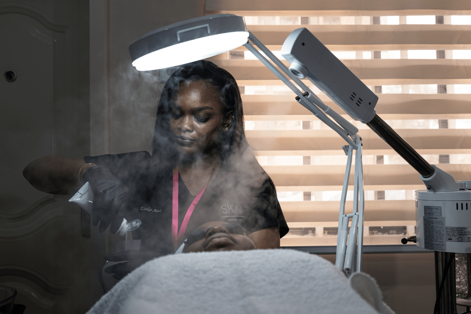 Ngozy Ezeka-Atta, Owner of Jaga Beauty in Lagos, Nigeria gives a client a facial.