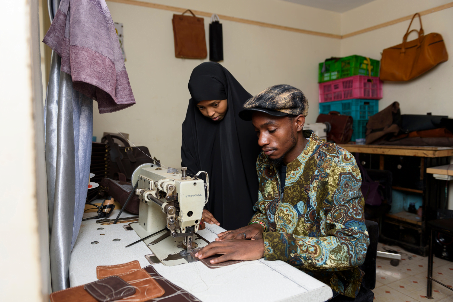 Muna Elmi instructs staff at her company, Mubi Leather in Nairobi