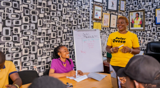 Damilola Asaleye leads a meeting at Ashdam Solar Company office