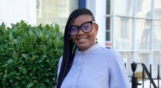 Marcia Skervin, Owner of Connect Your Dots, former mentee poses outside the Cherie Blair Foundation for Women's offices during a visit to London.